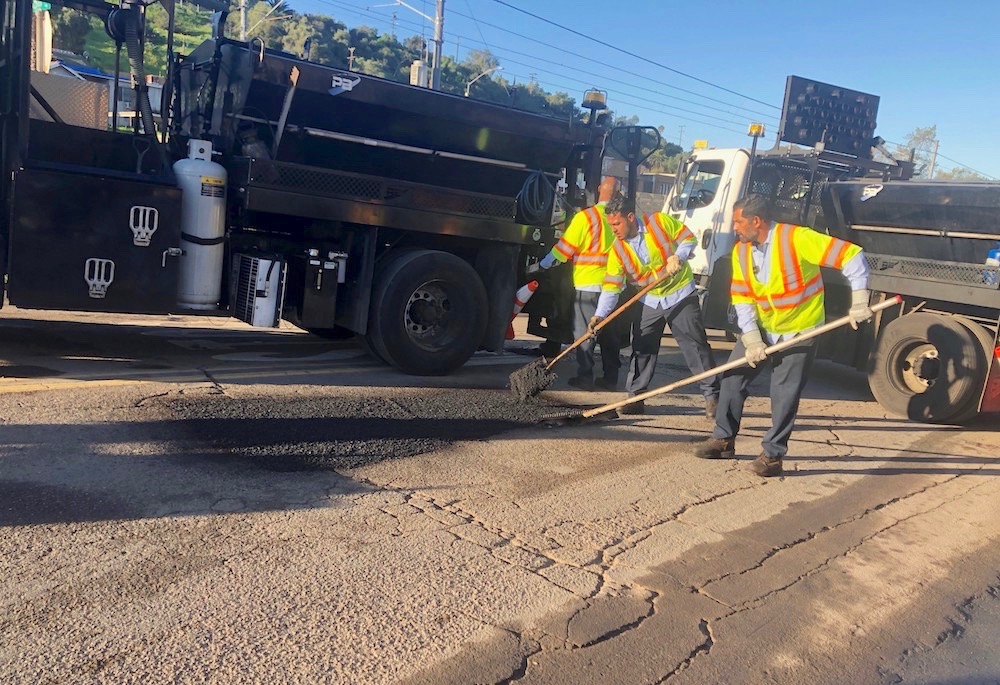 A work crew from the city of San Diego repairing potholes. (Photo courtesy of the city of San Diego)