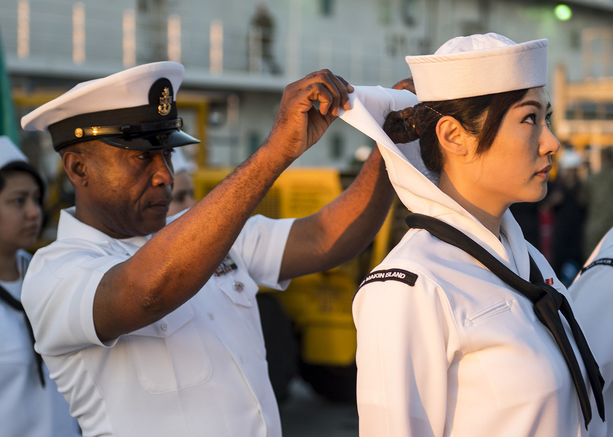 Senior Chief Aviation Support Equipment Technician Augustine Ilomuanya conducts a dress white uniform inspection on March 22, 2019, aboard the amphibious assault ship USS Makin Island. The ship is based in San Diego. (Photo by Mass Communication Specialist 2nd Class Colby A. Mothershead)