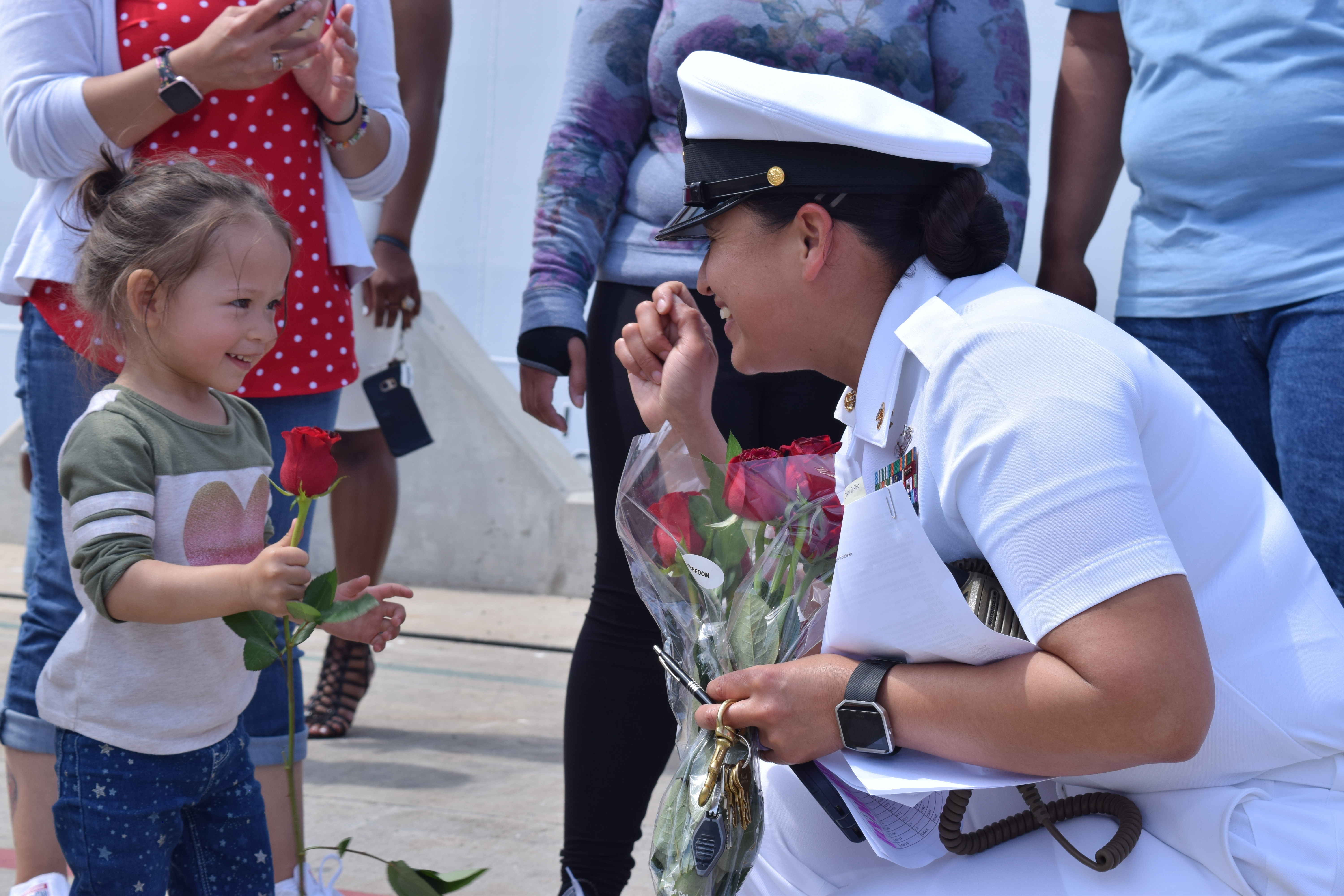 Chief Logistics Specialist Lillian Morales, assigned to USS Charleston, is greeted by her family during a homecoming at Naval Base San Diego. Charleston arrived to homeport in San Diego after successfully completing the ship's maiden voyage from the Austal USA shipyard in Mobile, Alabama. Charleston is the 11th ship in the littoral combat ship Independence-variant class. (U.S. Navy photo by Lt. j.g. Jasmine Spencer)
