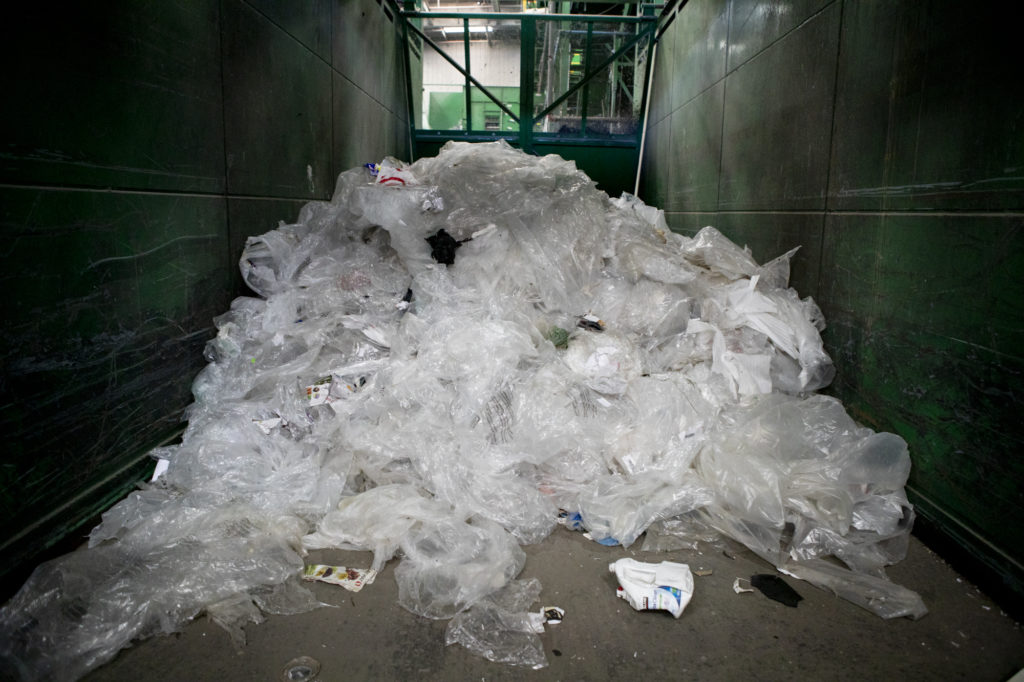 A pile of plastic bags at greenwaste recycling facility in San Jose on July 29, 2019. Photo by Anne Wernikoff for CalMatters.
