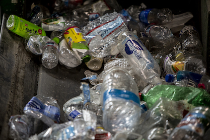 Plastic bottles on a conveyor belt at GreenWaste recovery in San Jose, California. Photo by Anne Wernikoff for CalMatters on July 29, 2019.