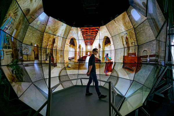 Joel Polizzi, visualization engineering technician at the Qualcomm Institute, stands in the middle of the SunCAVE that he helped construct (Photo courtesy of Falko Kuester)