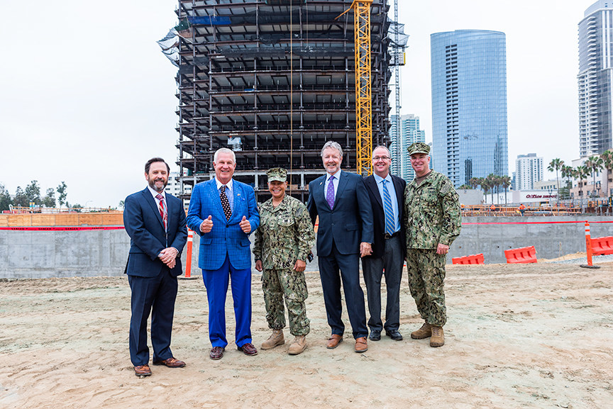 US Navy Region Southwest Headquarters Topping Out Ceremony. Joe Stuyvesant, executive director, Navy Region Southwest; Doug Manchester, Manchester Financial Group; Rear Adm. Bette Bolivar, commander, Navy Region Southwest; Perry Dealy, Dealy Development Inc.; John Greenip, Turner Construction Co.; Capt. Matt Ovios, chief of staff, Navy Region Southwest. (Photo credit: Javier Laos Photography/La Jolla Visions)