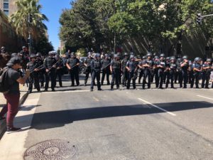 Police standing outside protests against Stephon Clark's shooting death in Sacramento, California. September 18, 2018. Photo by Byrhonda Lyons for CalMatters.