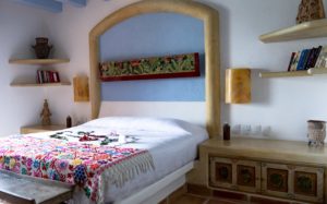  Class-meets-culture with folk art, custom headboards, and works by Oaxaca and Michoacán craftsmen.