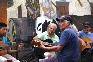 Musicians strum on the streets of El Centro.