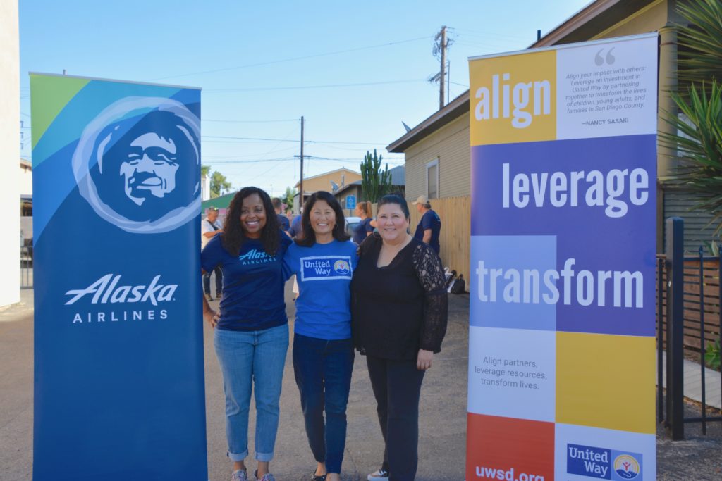 Shaunta Hyde, managing director of community relations at Alaska Airlines, left, is joined by Nancy Sasaki, CEO of United Way of San Diego, and Barbara Ybarra, Interim CEO of Barrio Logan College Institute, ay volunteer event in Barrio Logan. (Photo courtesy of United Way of San Diego County)