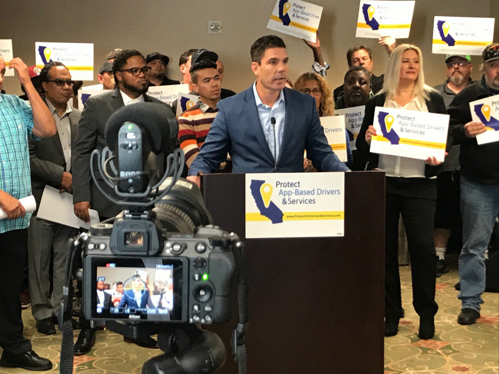 Brandon Castillo, spokesman for the initiative by Uber, Lyft and DoorDash, details the measure at the Sheraton Hotel in downtown Sacramento.