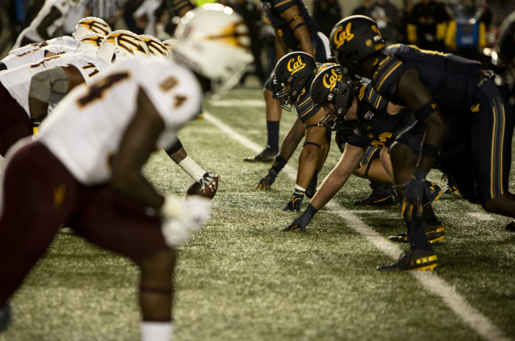Cal football players line up against ASU on Sept. 27, 2019. Confronted with a California law allowing student athletes to earn money from endorsements, the NCAA has shifted its policy on athlete pay. (Photo by Anne Wernikoff for CalMatters)