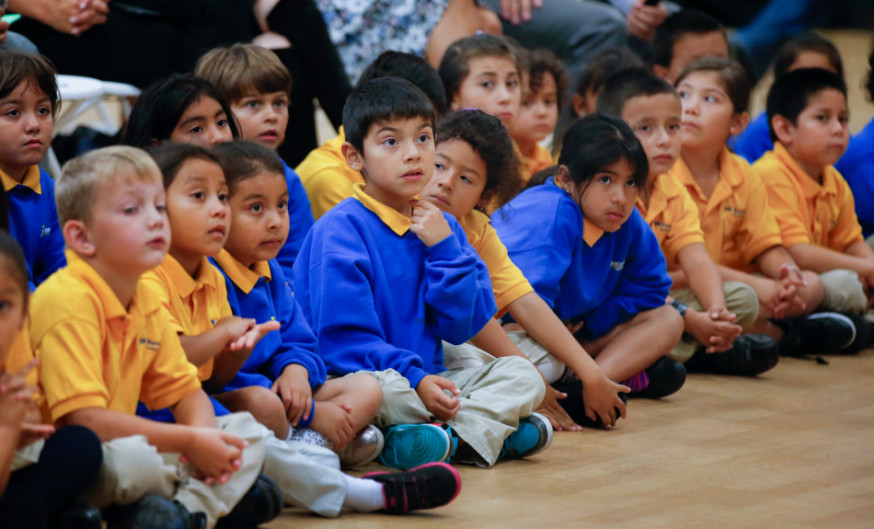 Students listen in 2015 at an assembly at KIPP Excelencia Community Prep, a public charter school, in Redwood City. Gov. (Photo by John Green/Bay Area News Group)