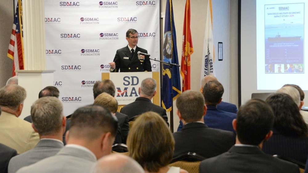 Rear Adm. Christian Becker, Commander, Naval Information Warfare Systems Command provides remarks during the roll out of the San Diego Military Advisory Council annual economic impact study. (U.S. Navy photo by Rick Naystatt)