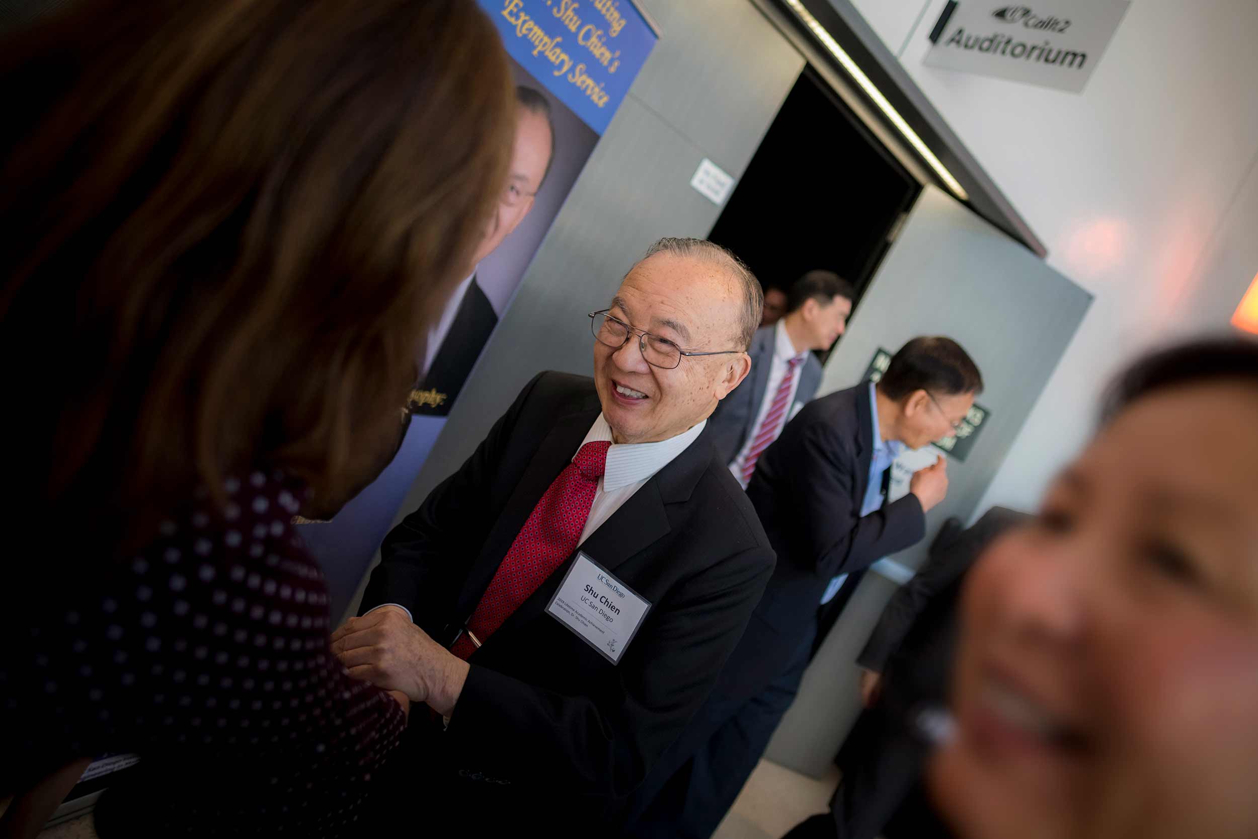 Shu Chien greets the more than 200 people who attended the celebration in honor of his retirement. (Photo by Erik Jepsen/UC San Diego Publications)