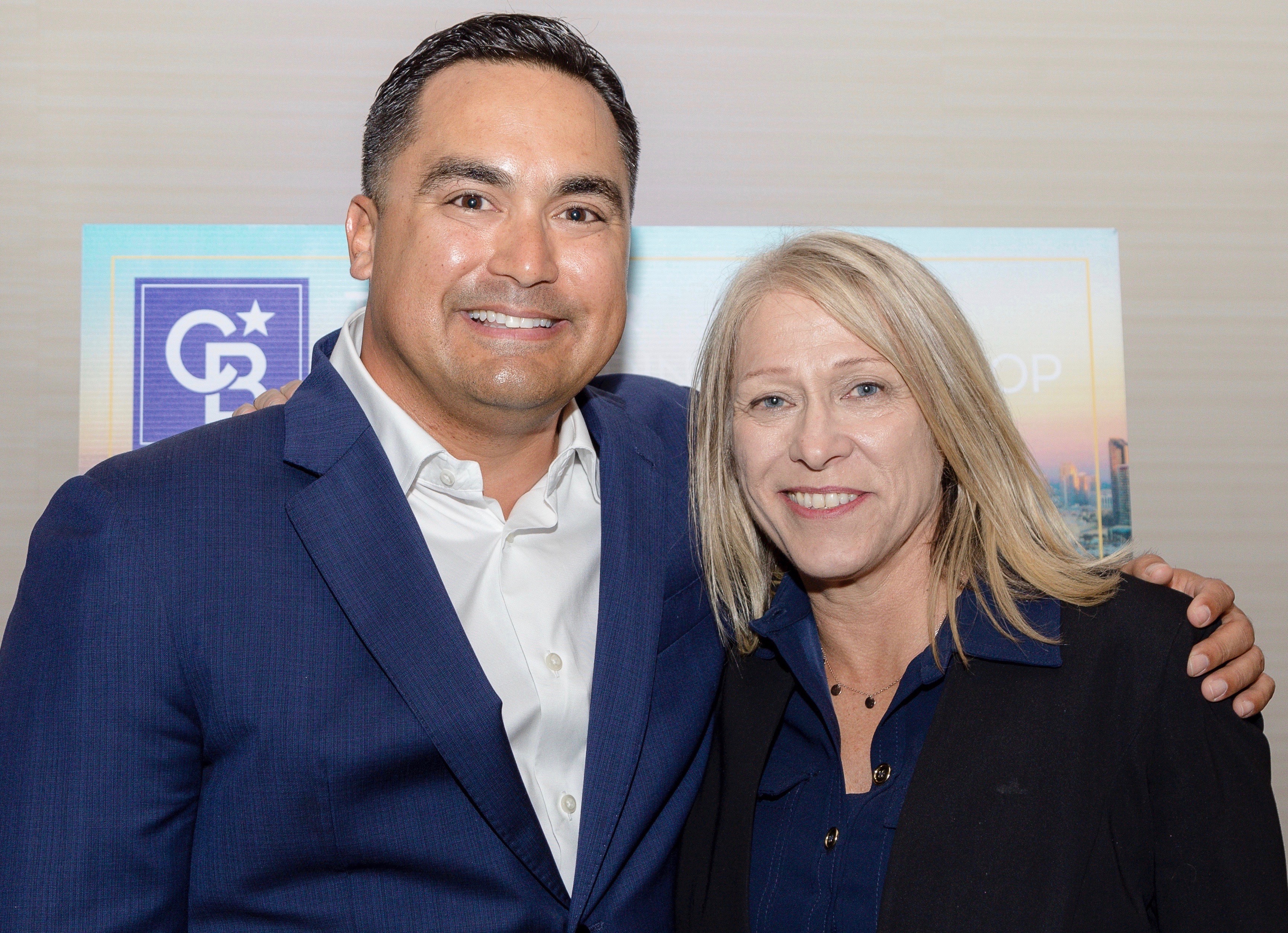 CBW President Peter Mendiola and Penny Nathan, president/CEO of Ascent Realty.