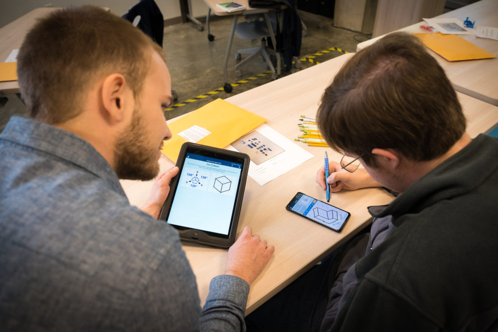 A student and teaching assistant use the Spatial Vis Engineering app on a tablet and smart phone. (Courtesy UCSD)