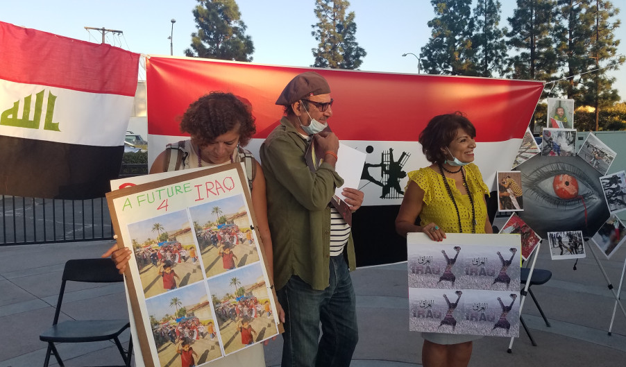 Wedad Schlotte, the vice-president of the San Diego chapter of the American-Arab Anti-Discrimination Committee, helps lead a protest of the anti-Iraqi government over alleged corruption and economic hardships in El Cajon. (Photo by Claire Trageser)