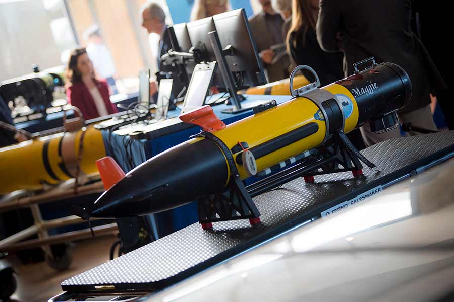 Scripps oceanographers showcased an array of surface and underwater gliders during the Center of Expertise launch, including ‘Maggie,’ an underwater vehicle equipped with a magnetometer payload to detect seabed debris.