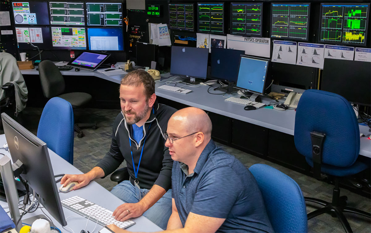 General Atomics researchers Brian Sammuli (left) and Jayson Barr (right) developed an innovative machine learning–based control system that can optimize fusion plasma performance far faster than previous methods. (Photo courtesy of General Atomics)