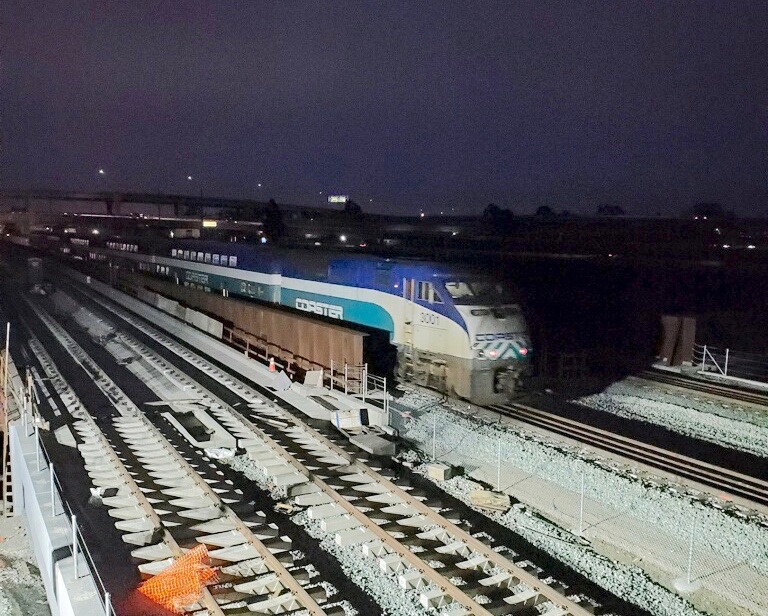 The Coaster crosses the bridge.