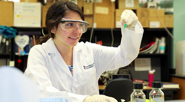 SDSU senior Citlayi Villaseñor conducts research in biochemistry professor Tom Huxford's lab. (Photo: Kellie Woodhouse)
