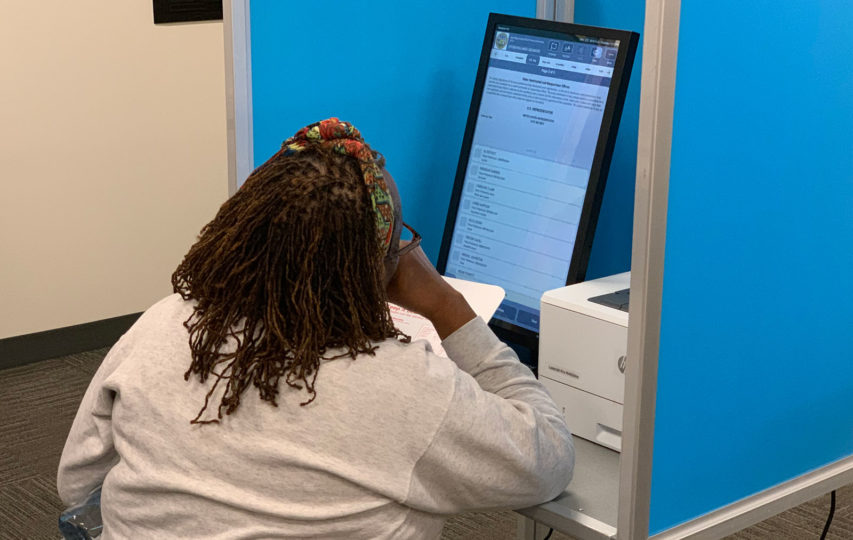 Employee test ballot marking device at the Registrar’s office last November.