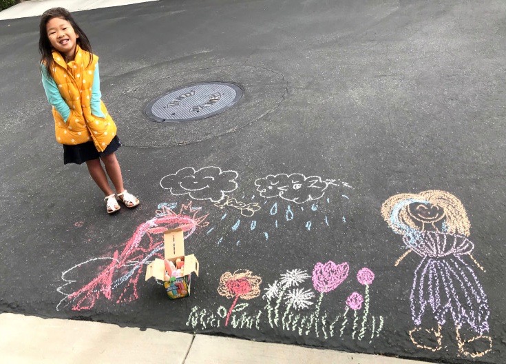 Arianna Ko, 5, shows off her artistic talents outside her Irvine home. (Photo by Chairo Ko)