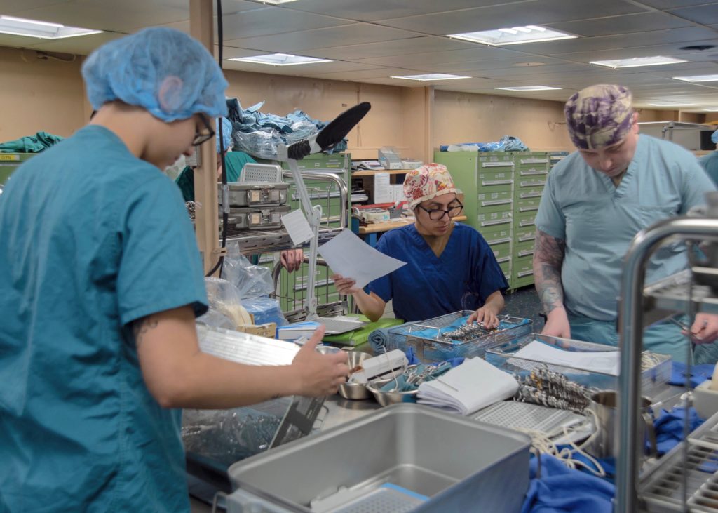 PACIFIC OCEAN -- Sailors prepare surgical equipment to be sterilized aboard the Military Sealift Command hospital ship USNS Mercy, which has been deployed in support of the nation’s COVID-19 response efforts, and will serve as a referral hospital for non-COVID-19 patients currently admitted to shore-based hospitals. This allows shore base hospitals to focus their efforts on COVID-19 cases. (Navy photo by Mass Communication Specialist Seaman Luke Cunningham)