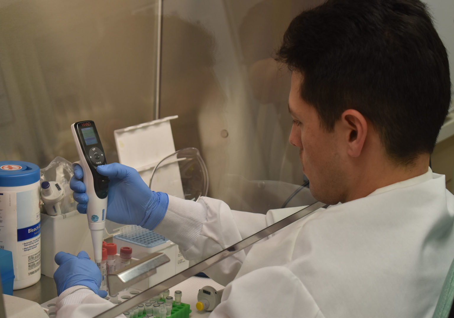 County Microbiologist Jovan Shepherd prepares a specimen for testing for new coronavirus. (Photo courtesy of San Diego County)