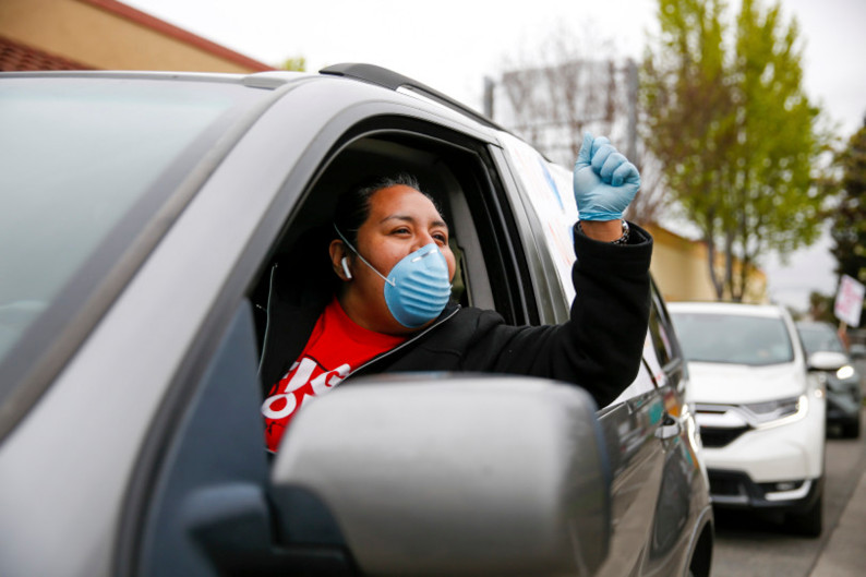 Guadelupe Sanchez, an employee at a McDonald's restaurant in San Leandro, led a caravan of fellow essential workers as they circled a Hayward location on April 9 to demanding wage increases and more personal protective equipment from the corporation as essential workers during the coronavirus pandemic. (Photo by Dylan Bouscher, Bay Area News Group)