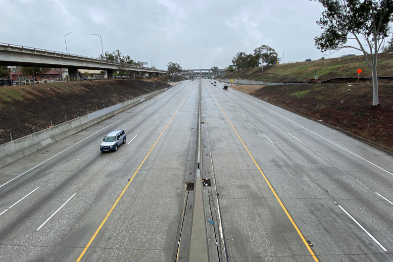 A nearly-empty freeway in Los Angeles. (Photo by Kirby Lee via AP)