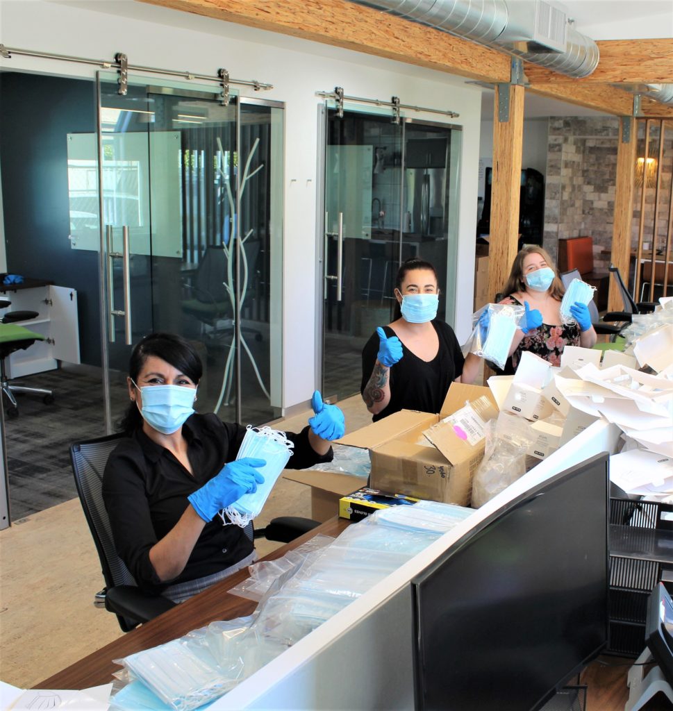 F&F Properties employees with some of the 2,000 masks going to hospitals and staffs.