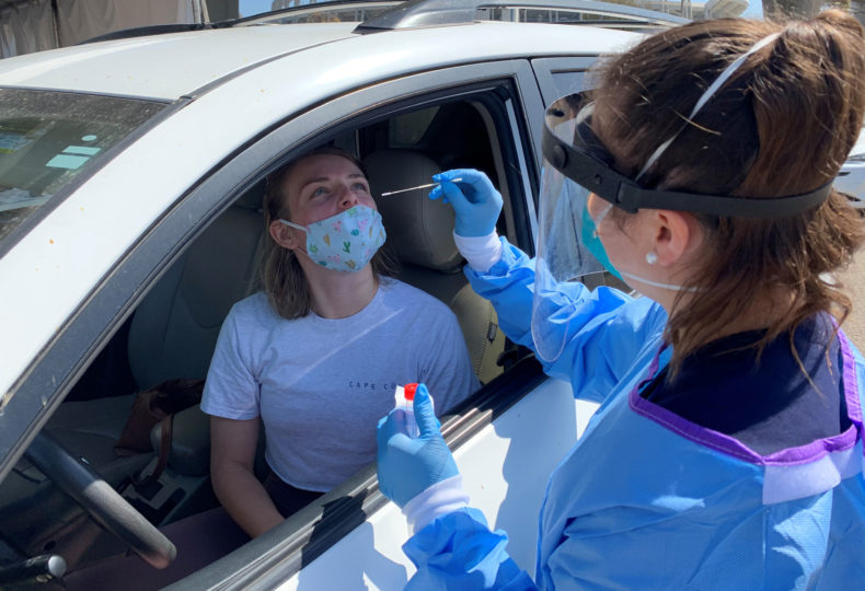 County public health nurse administers a COVID-19 test.