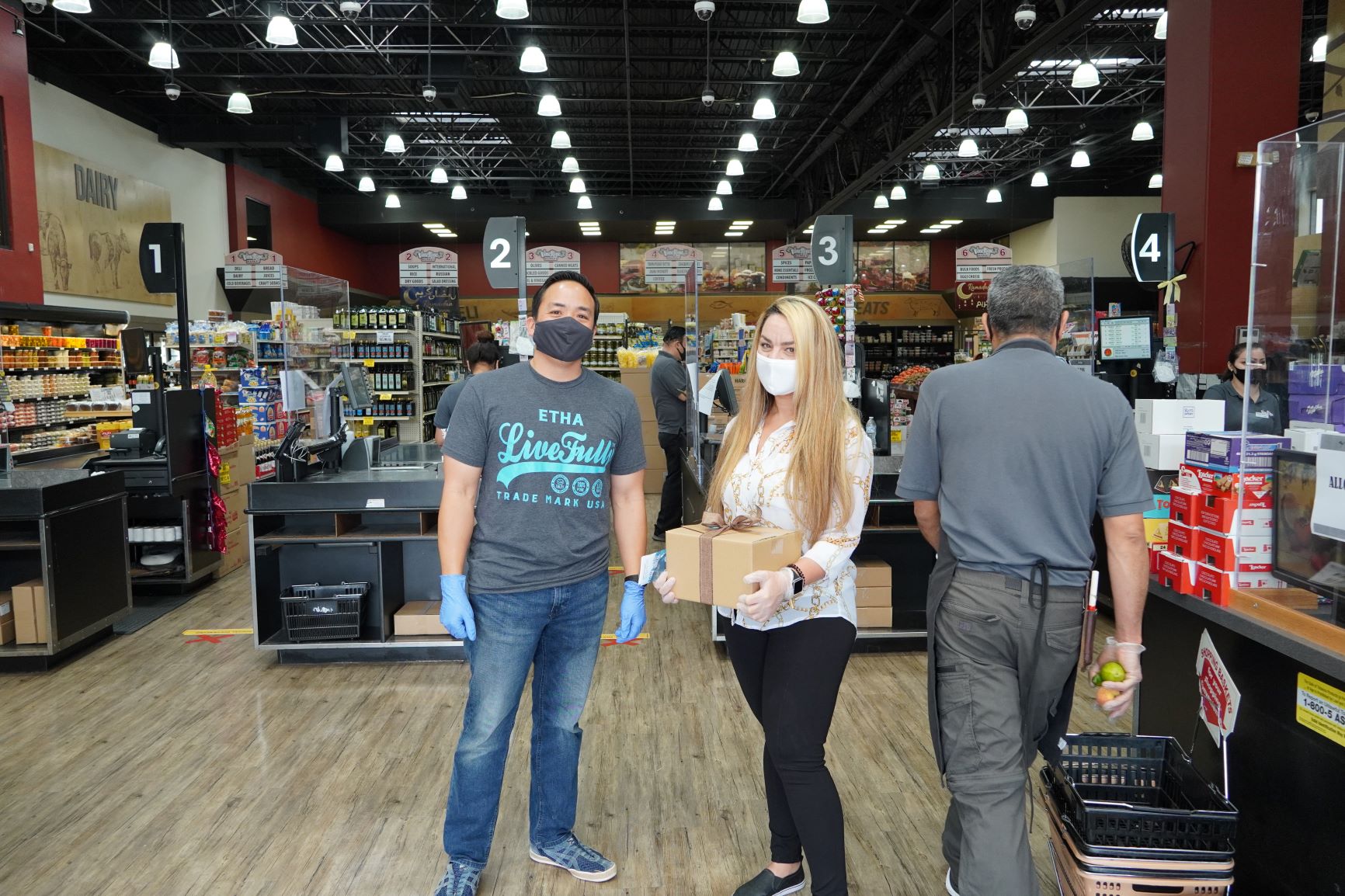 Victor Chung, co-founder of ETHA Natural Botanicals, at Vine Ripe Market in La Mesa with store manager Lena.