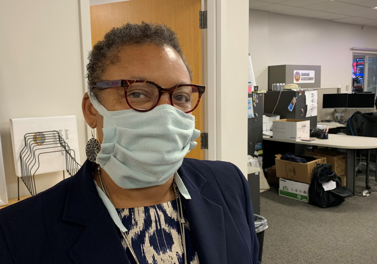 County Public Health Officer Wilma Wooten wears a face covering to remind the public one is required when out in public.