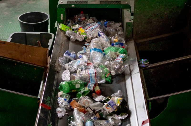 Plastic bottles on a conveyor belt at GreenWaste Recovery's facility in San Jose on July 29, 2019. (Photo by Anne Wernikoff for CalMatters)