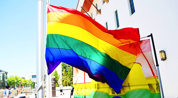 The Pride Flag flying adjacent to the Conrad Prebys Aztec Student Union. (SDSU photo)