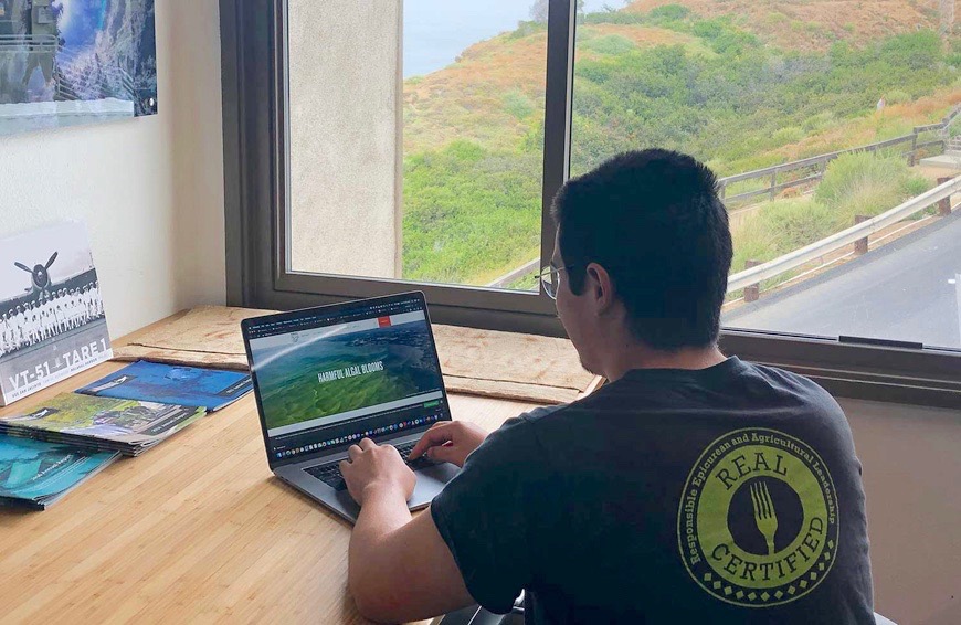 UC San Diego student Raymond Young works on Boeing-sponsored team project for the class Hacking for the Oceans. (Photo courtesy of UC San Diego)