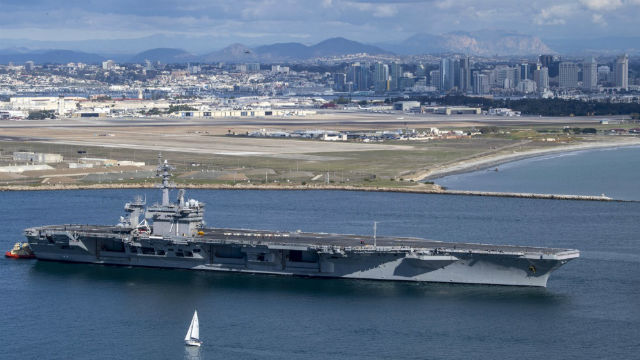 The USS Theodore Roosevelt passes North Island as it leaves on deployment in January. (Photo by Mass Communication Specialist 2nd Class Kyle Carlstrom)