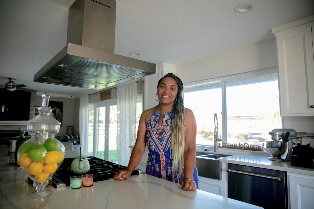 Sharie Wilson in the kitchen of her remodeled Elk Grove home on June 22, 2020. Wilson says that when the bought the home it was the ‘worst on the block’ but was able to turn it into a space that she’s proud of. (Photo by Anne Wernikoff for CalMatters)