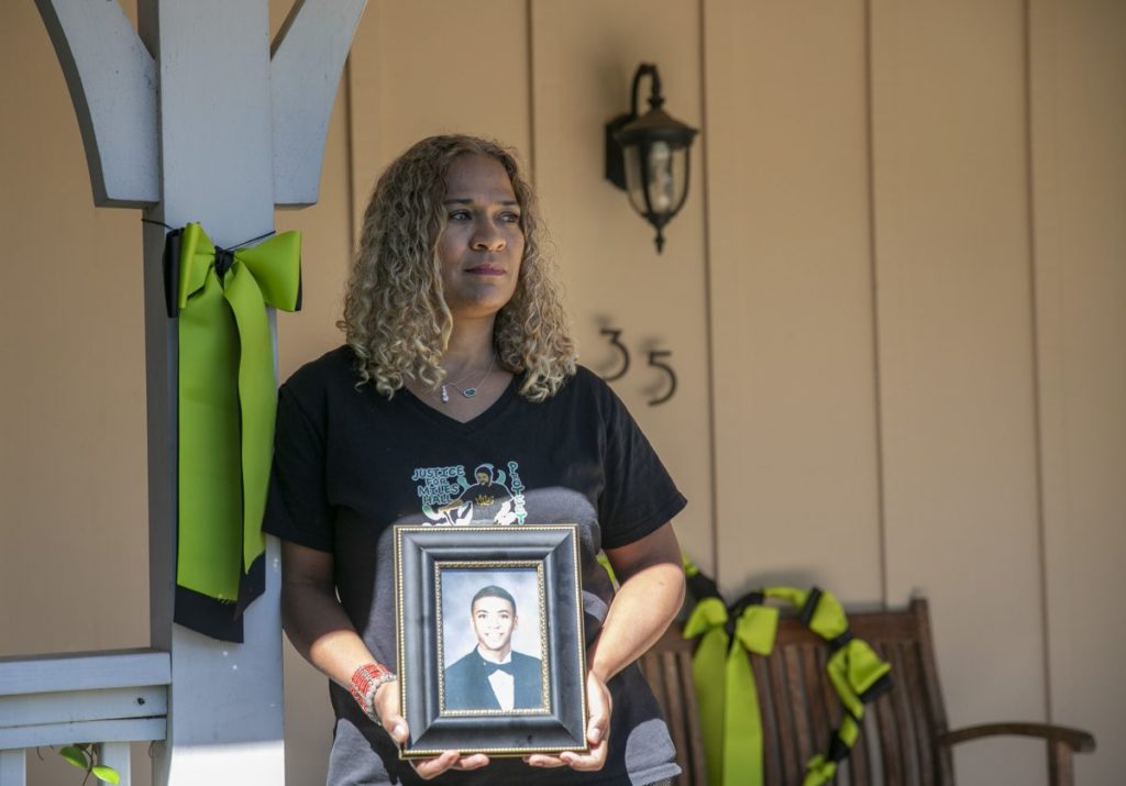 Taun Hall with a photo of her son, Miles, who was killed last year by Walnut Creek police during a mental health crisis. (Photo by Anne Wernikoff for CalMatters)