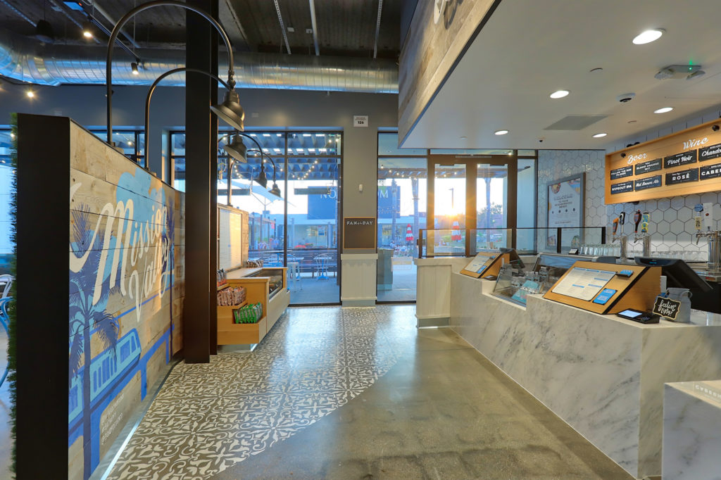 Pictured is the Mission Valley location of Mendocino Farms featuring murals from local artist, Pandr Design Co.