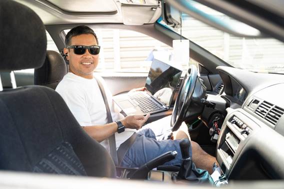 A San Diego Mesa College student at a laptop distribution event.