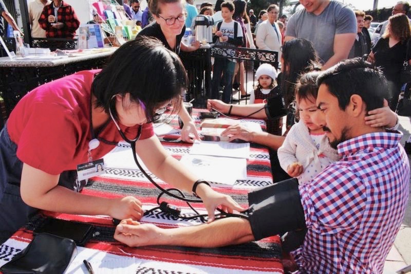 Volunteers take blood pressure readings as part of the Feb. 14 Love Your Heart event.