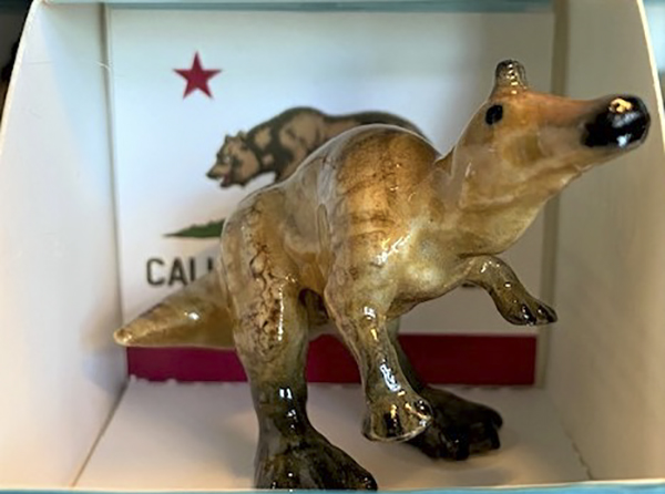 The dinosaur figurine on sale at the Capitol Museum. (Photo via Developmental Disabilities Service Organization)