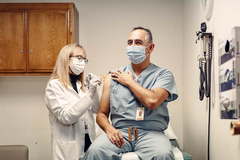 Dr. Andres Smith receives the COVID-19 vaccine. (Photo credit: Leslie Aquinde/Sharp Chula Vista Medical Center)