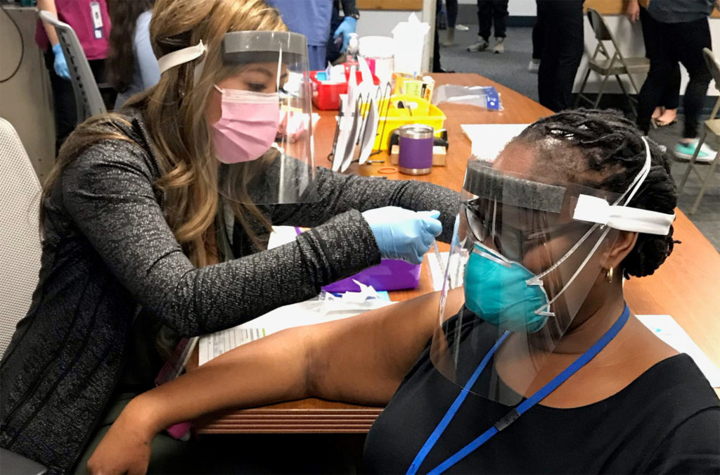 An employee at the County Psychiatric Hospital gets her first dose of COVID-19 vaccine. (Credit: San Diego County)