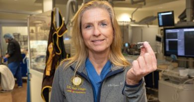 Holding the device and pictured above is Ulrika Birgersdotter-Green, MD, cardiologist and director of pacemaker and ICD services at UC San Diego Health. (Photo credit: Kyle Dykes | UC San Diego Health)