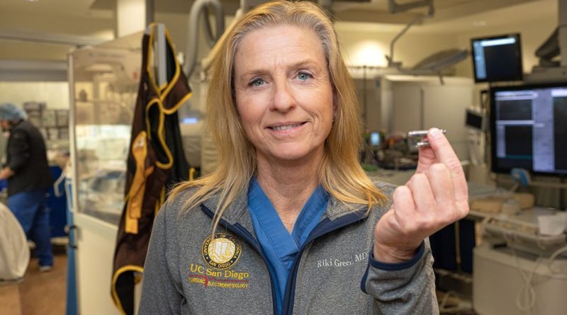 Holding the device and pictured above is Ulrika Birgersdotter-Green, MD, cardiologist and director of pacemaker and ICD services at UC San Diego Health. (Photo credit: Kyle Dykes | UC San Diego Health)